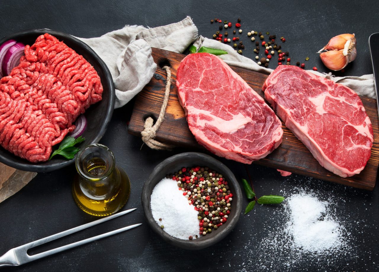 Variety,Of,Raw,Meat,With,Seasoning,On,Dark,Background.,Top